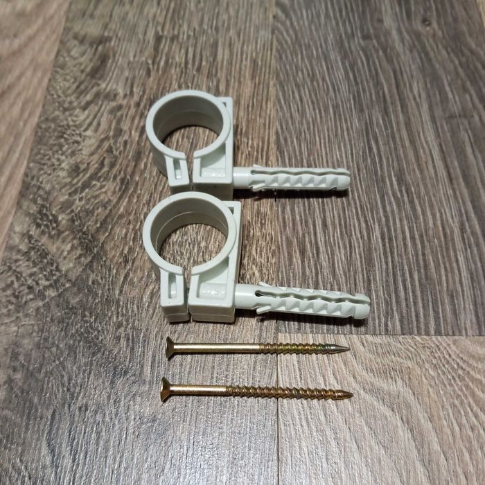 Тримач (обойма) для труб (кабелю) 25-27мм