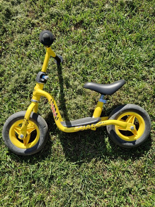 2 rowery biegowe (Puky LRM żółty i Movino) oraz kask