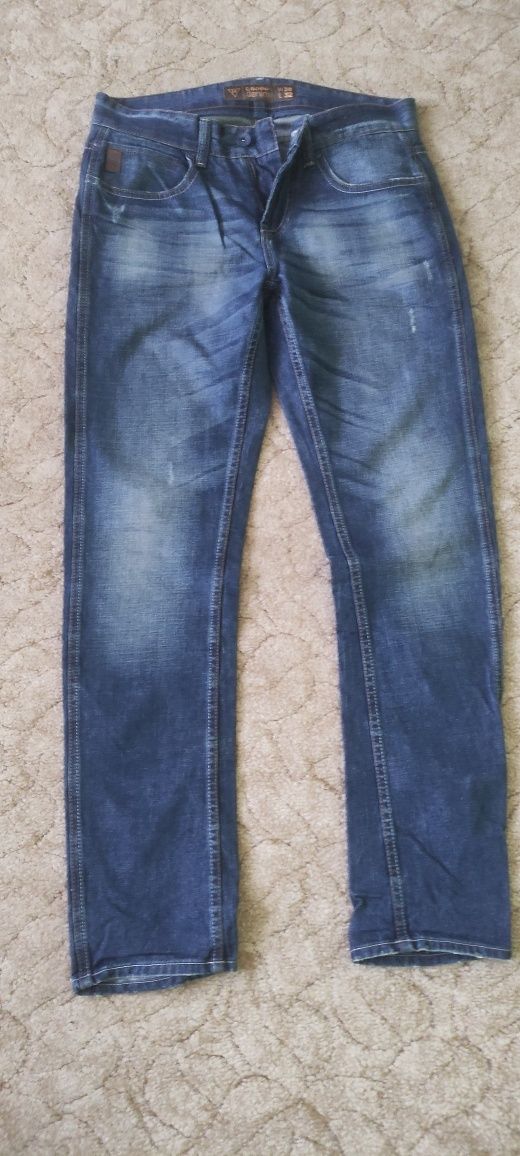 Spodnie męskie jeansowe Cropp z przetarciami 30/32