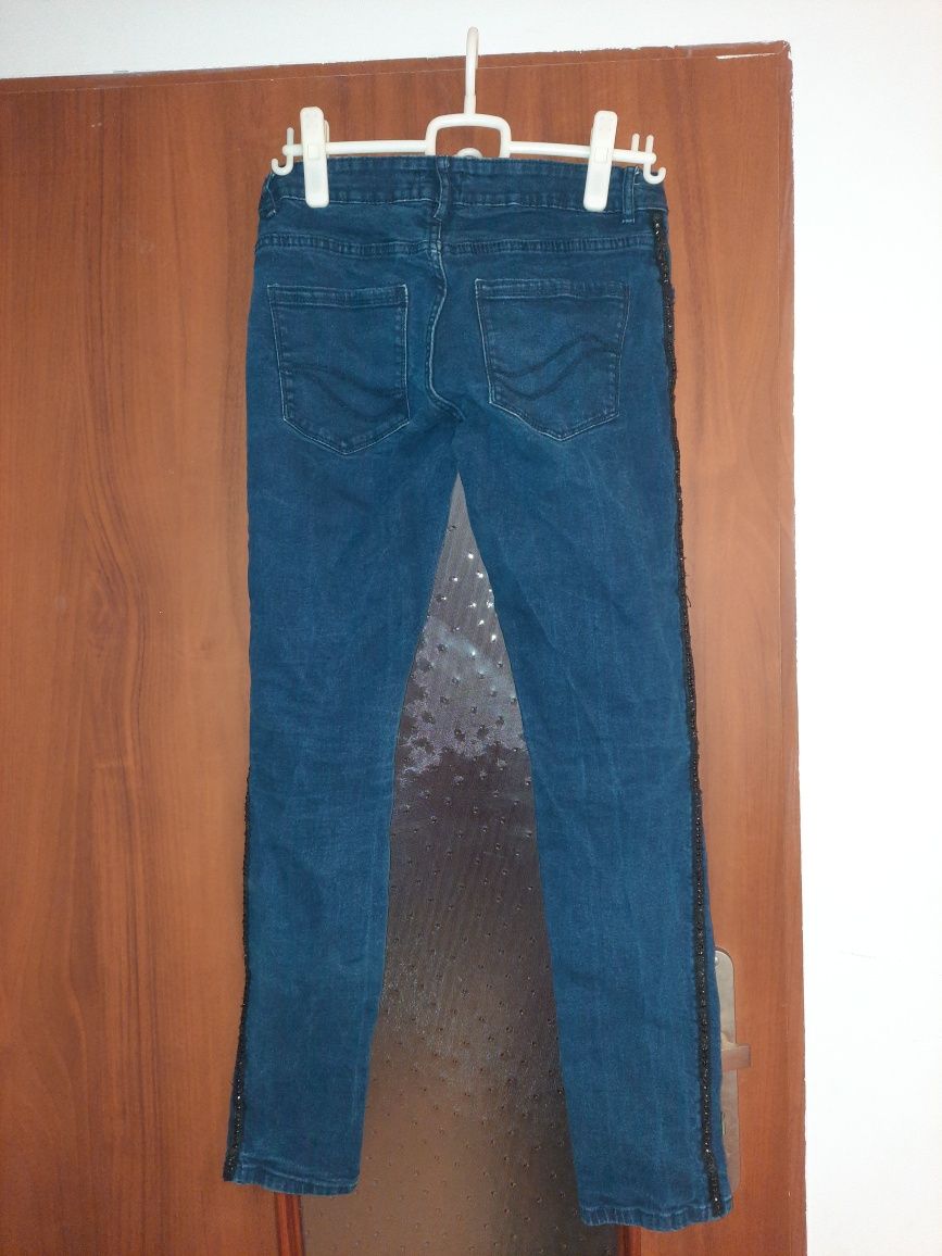 Ciemnoniebieskie spodnie - UP2FASHION- rozmiar 42 z ozdobami po bokach