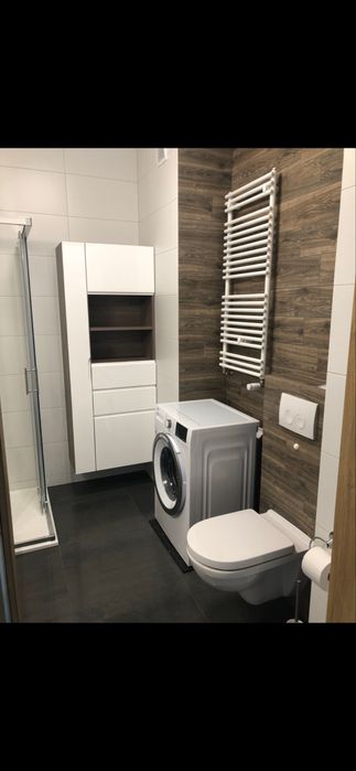 Funcjonalna kawalerka 30m² z parkingiem i komórka lokatorska