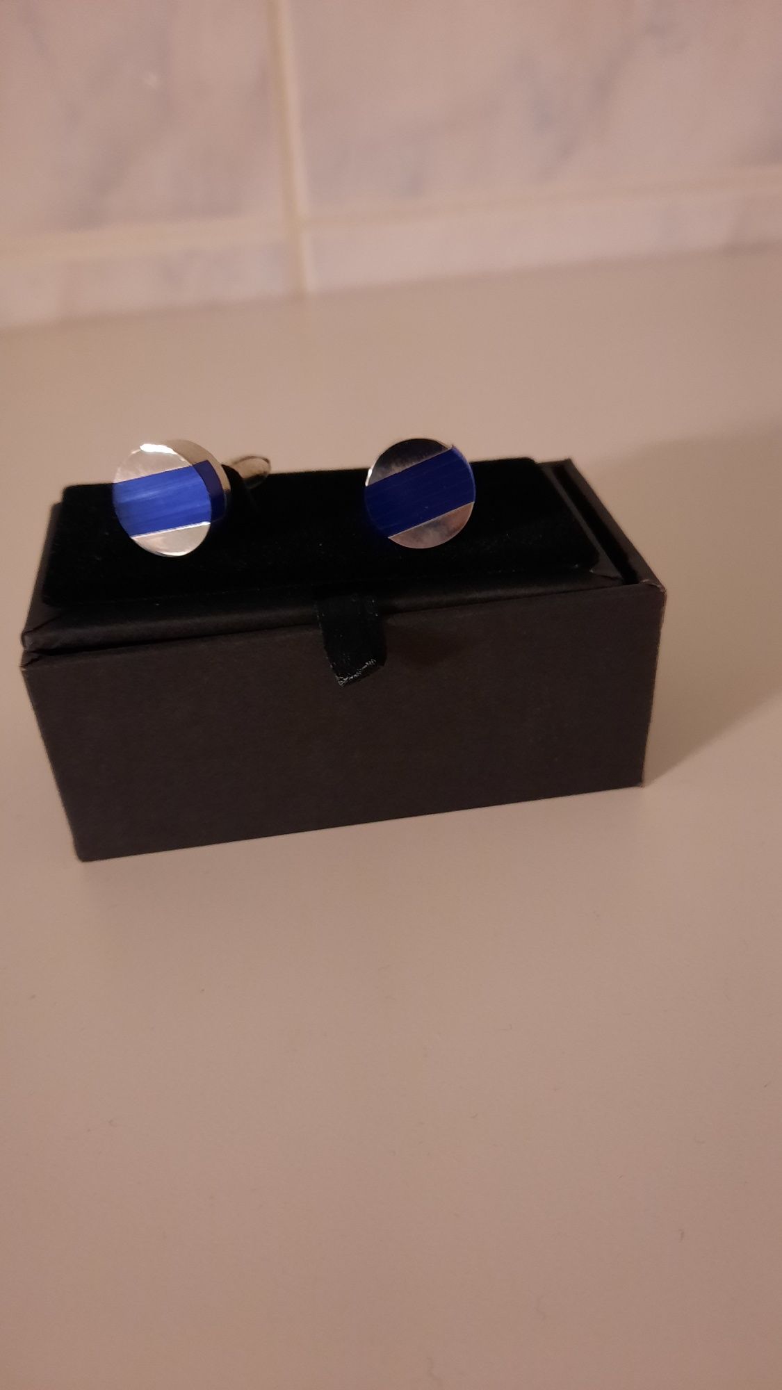 Botões de punho com azul