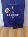 Saco e miniatura do perfume Boucheron