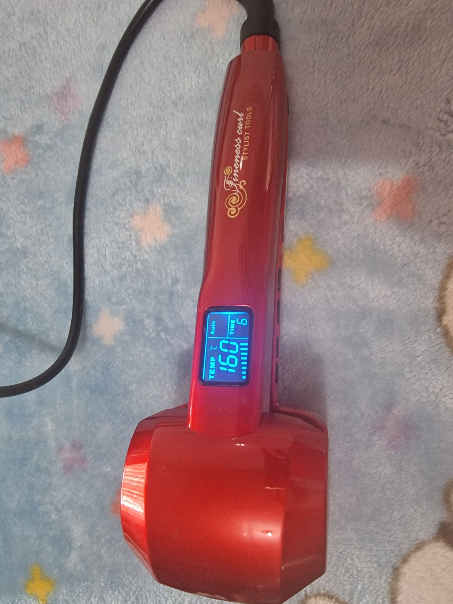 Modelador de cabelo automático