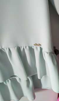 Miętowa bluzka baskinka