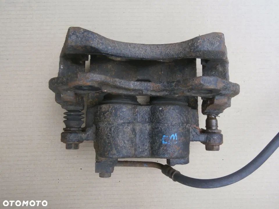 Zacisk Hamulcowy Przód lewy Jeep Grand Cherokee 2,7 Crd Wj