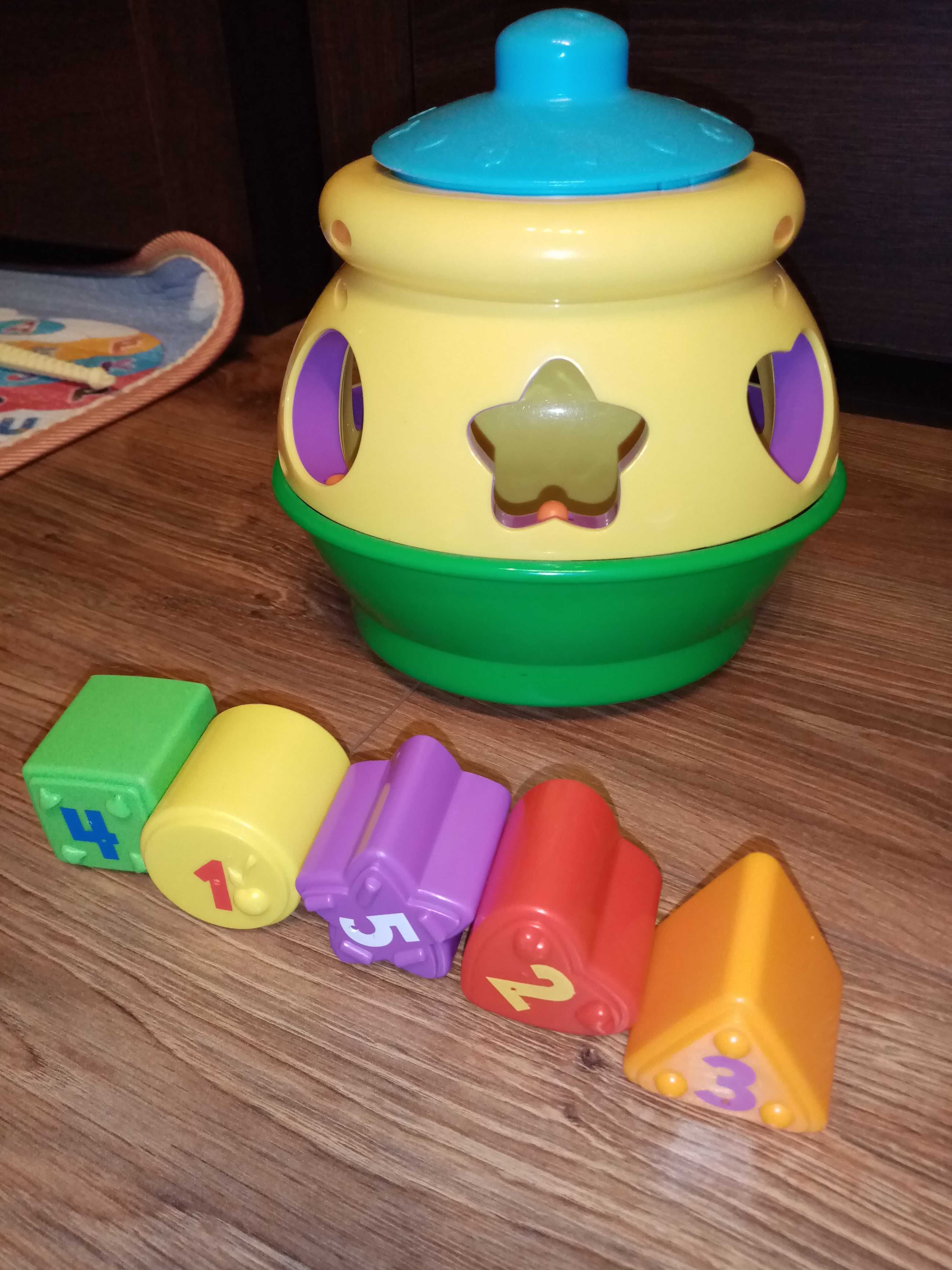 Garnuszek na klocuszek Fisher price