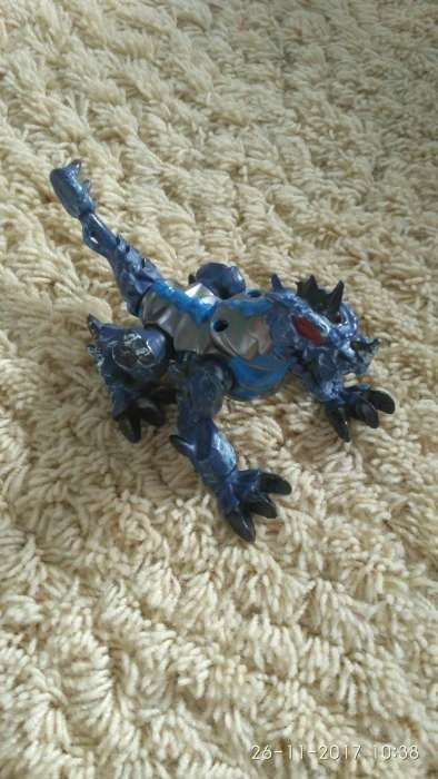 Игрушечный синий дракон
