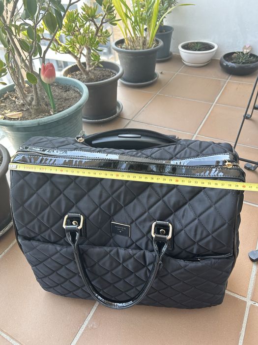 Mala de viagem ou computador Parfois