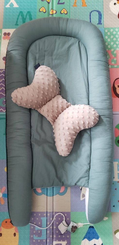 Kokon, gniazdko z poduszką dla dziecka