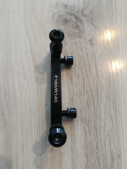 Adapter hamulca tarczowego do roweru lub hulajnogi