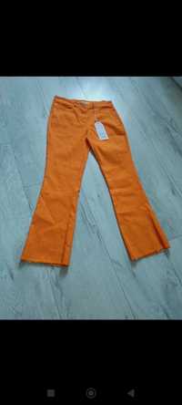 Spodnie damskie rozmiar 36,pomarańcz ,elastyczne ,szarpana nogawka