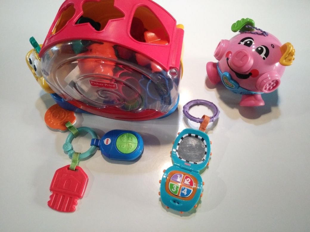 Zestaw zabawek Fisher-Price ślimak klocki świnka pilot telefon.