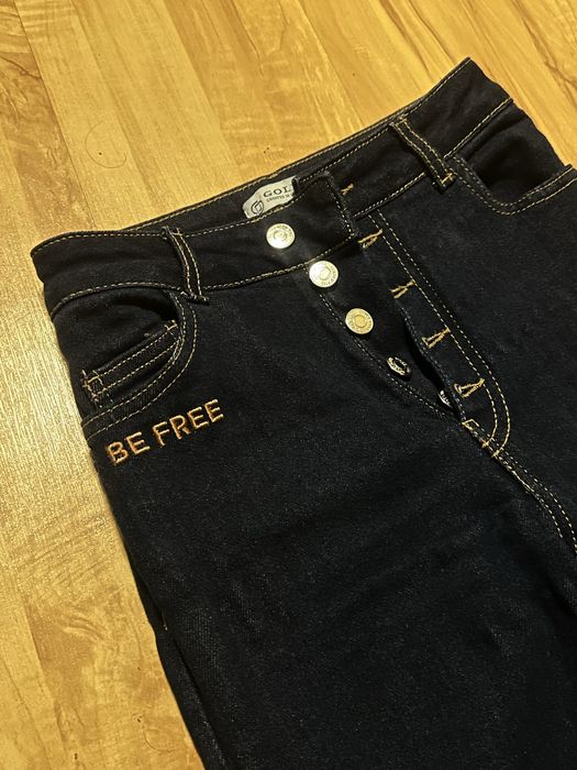 Джинси кльош в темно-синьому кольорі