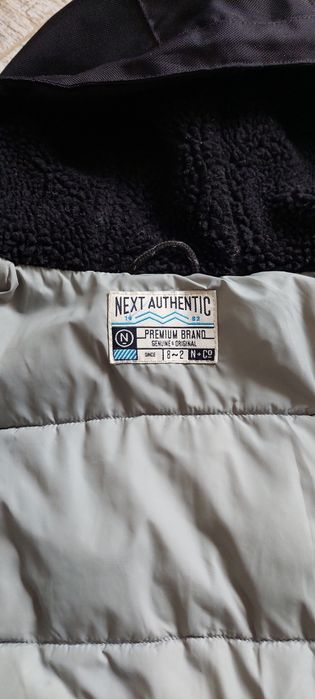 Тепла куртка next