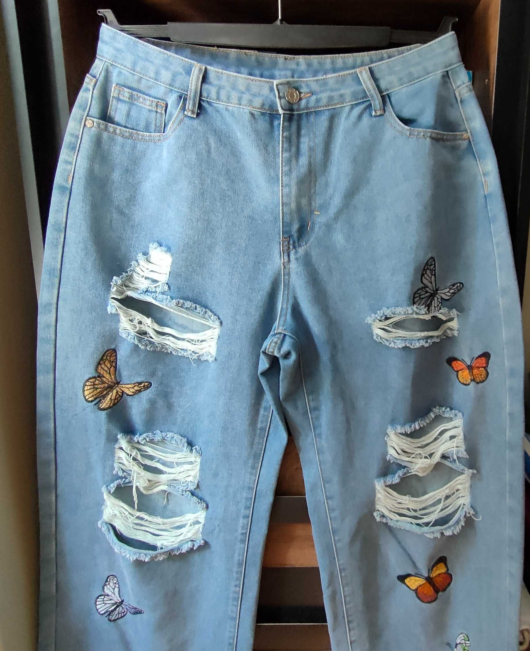 Spodnie jeansowe z dziurami i motylami L/XL