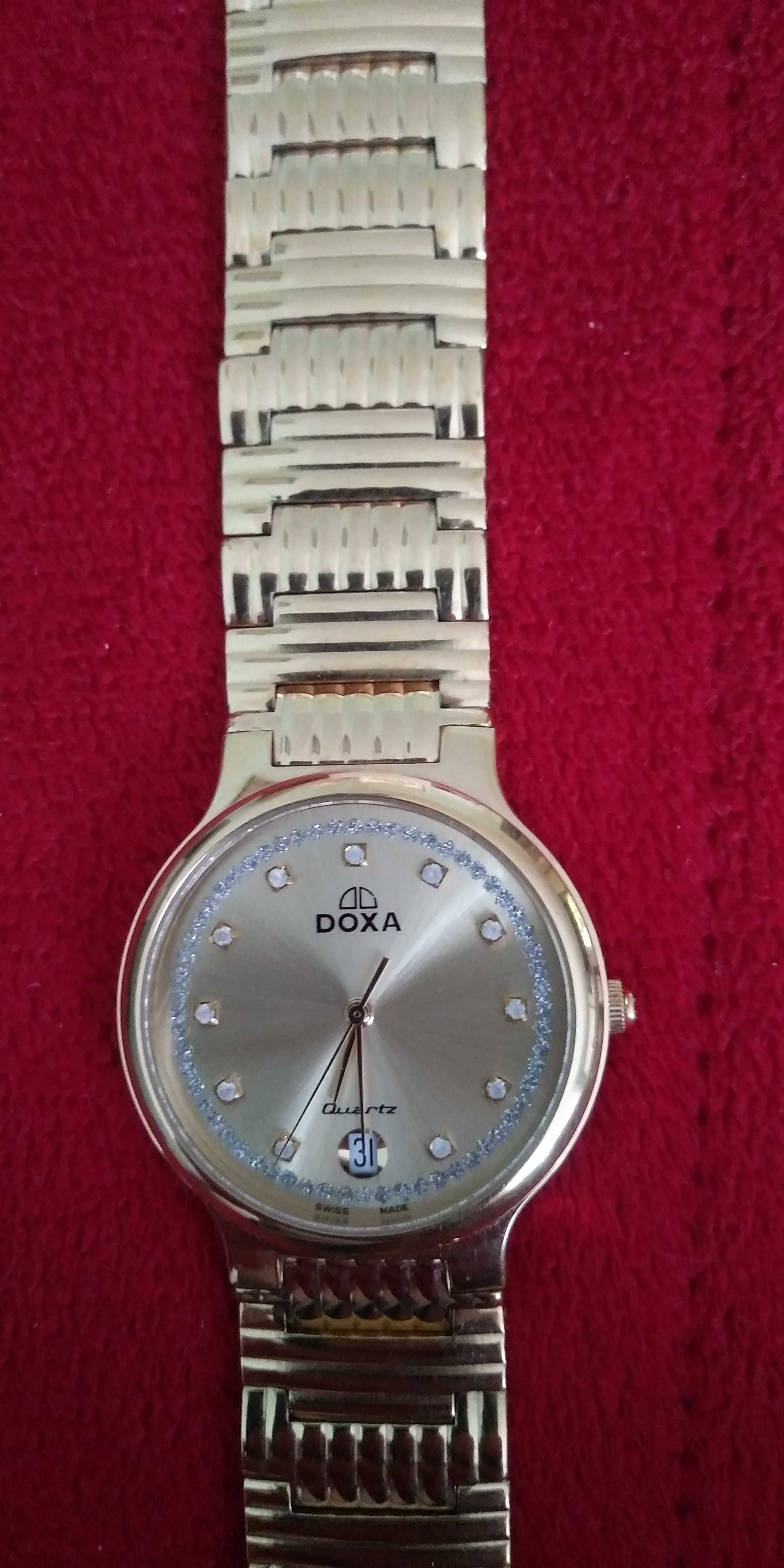 Zegarek kwarcowy Doxa , pozłacana bransoletka i zegarek .