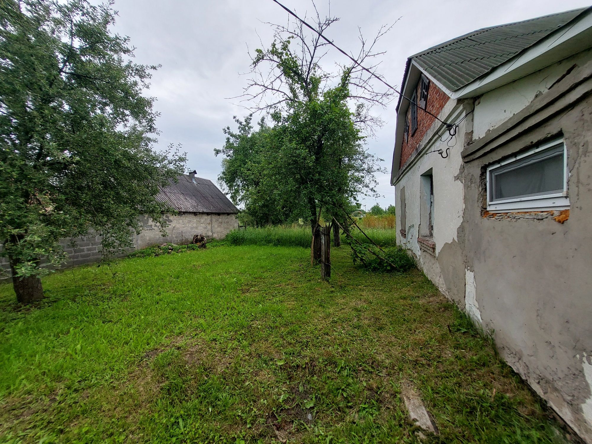 Будинок із земельною ділягкою під сільське господарство 0.1500 га