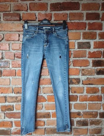 Spodnie jeansy z przetarciami M