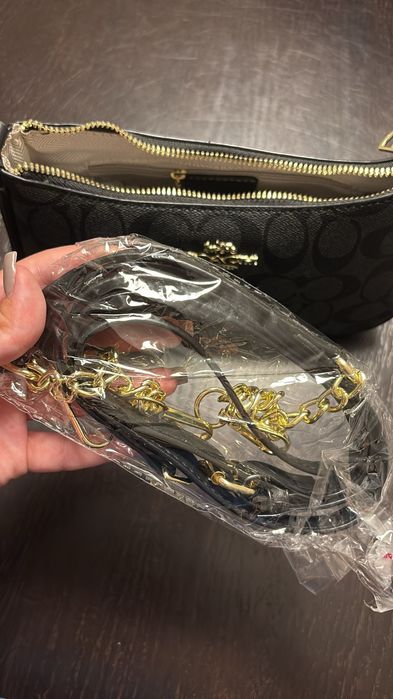 Mala Coach com duas alças e saco
