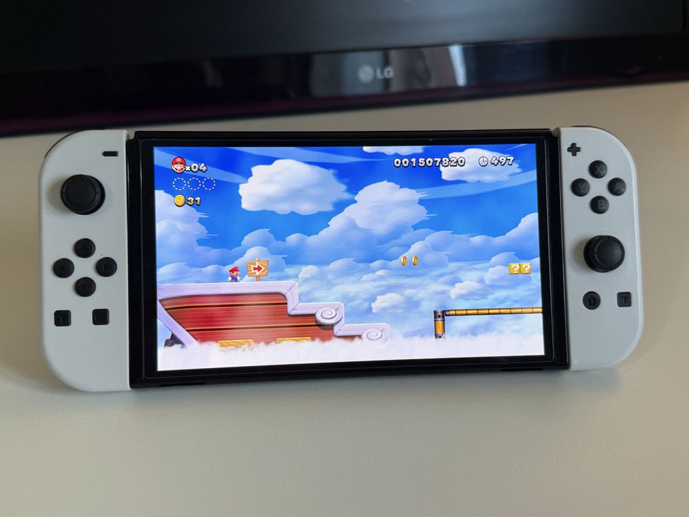 Nintendo Switch OLED + Super Mario Bros U Deluxe + Mala Transporte