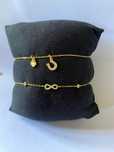 Pulseiras em prata dourada de marca