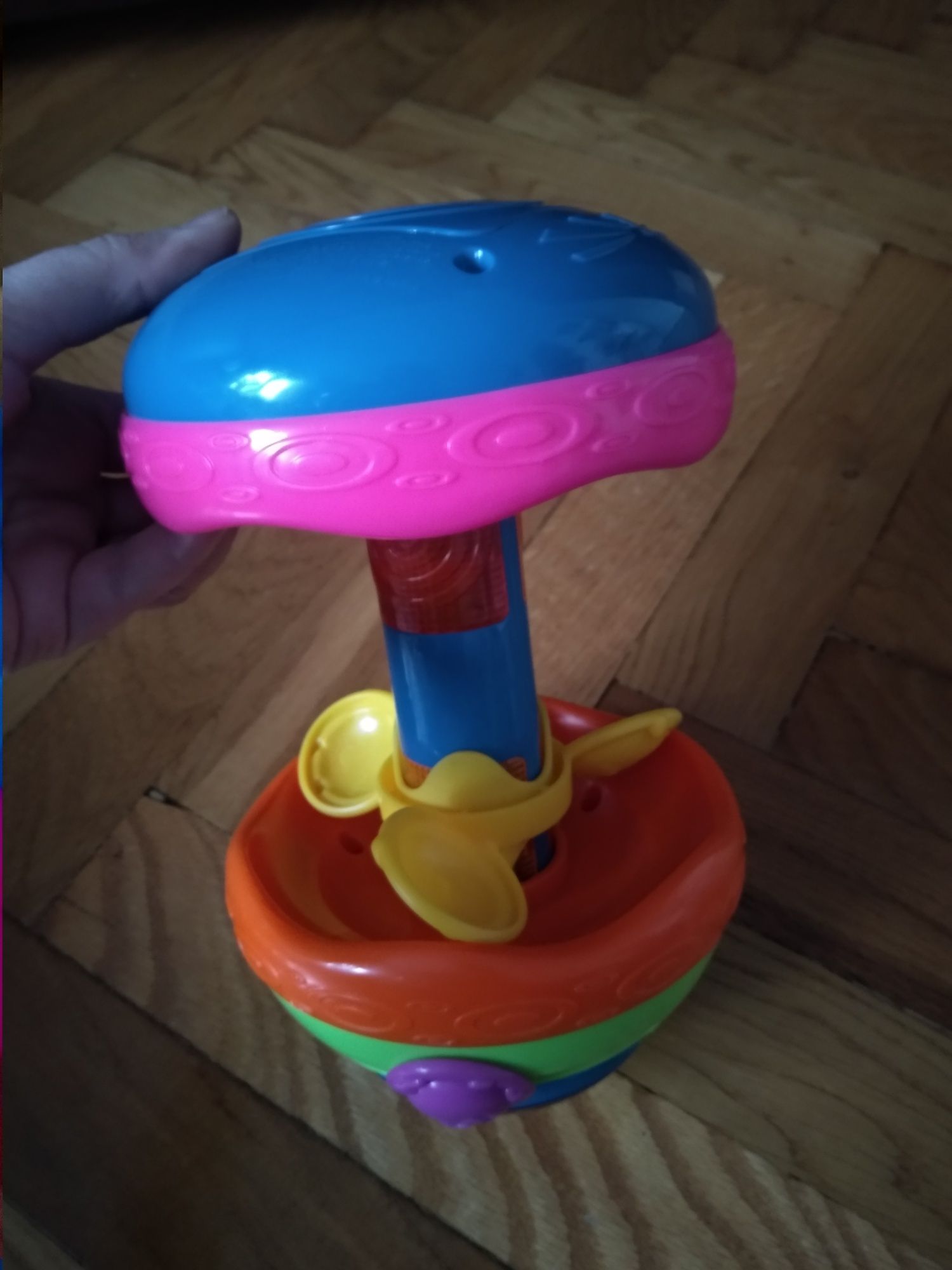 Grzechotka zabawka brzęczek Fisher Price kołowrotek z melodyjki