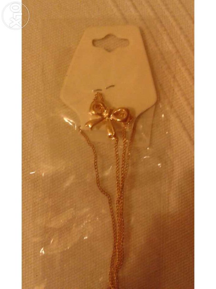 Colar Laço Dourado novo