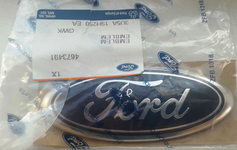 Емблема решітки радіатора 4673491 Ford