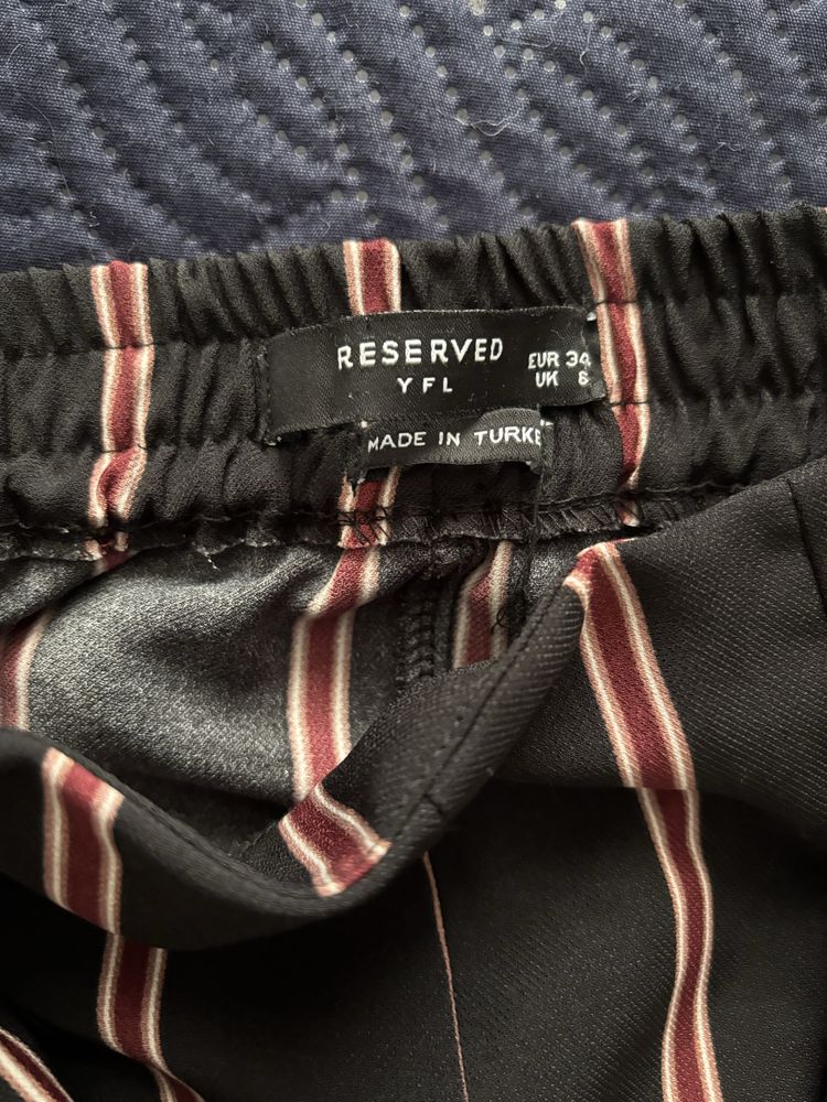 Reserved spodnie damskie w paski luźne eleganckie wyski stan
