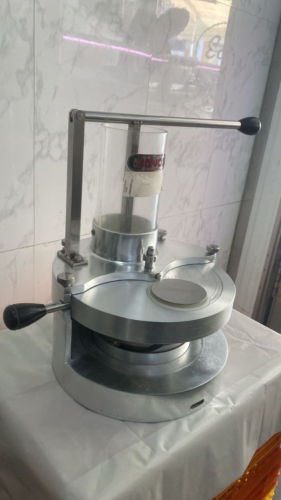 Maquina transformadora de hamburgueres