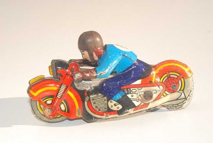 Stara zabawka motocyklista blaszany motor antyk