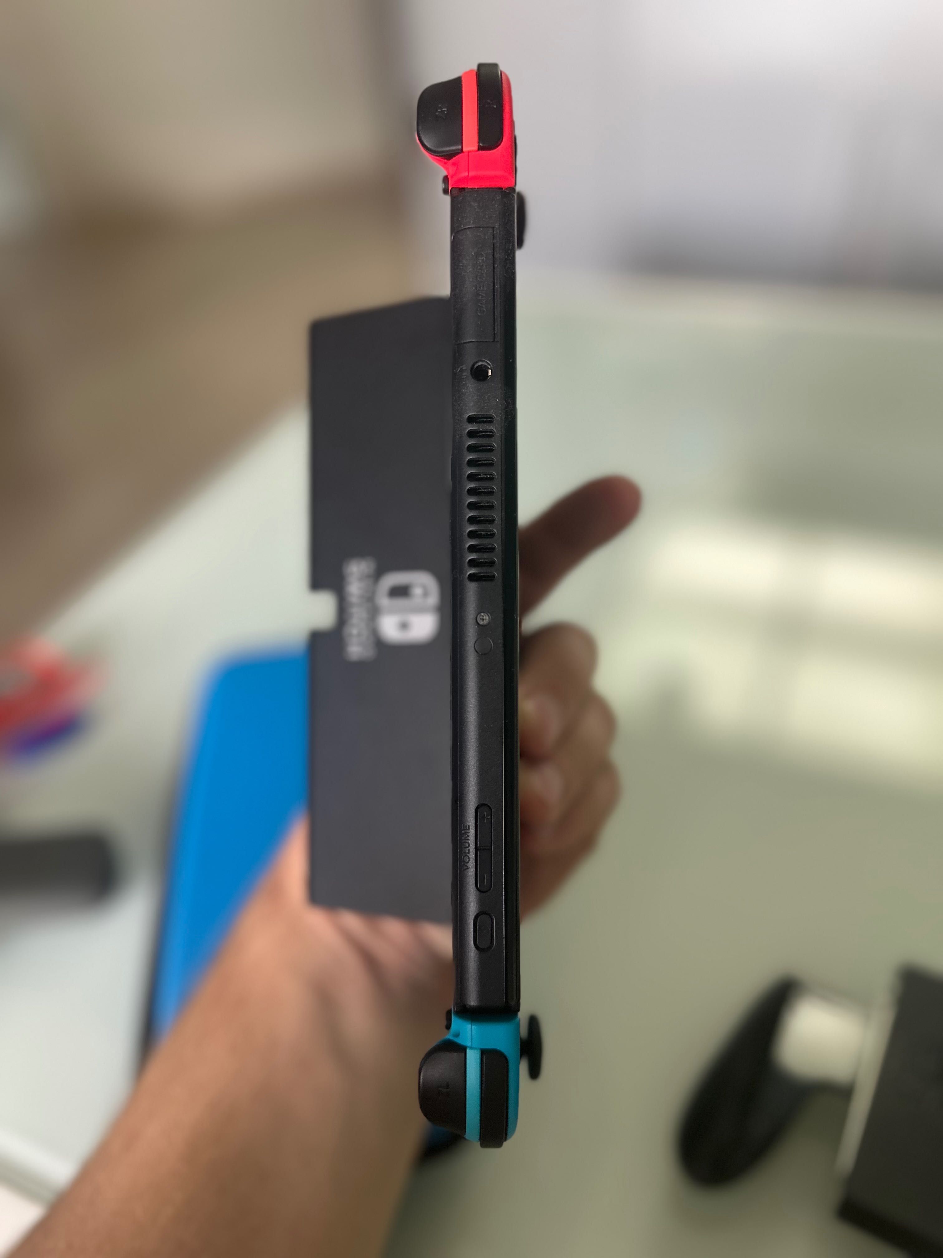 Nintendo Switch OLED with Neon Blue and Neon Red Joy-Con