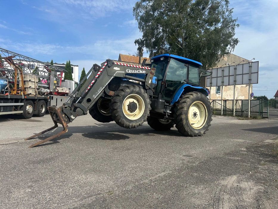 Ciągnik New Holland TM 130 z ładowarką czołową (TUR) - Import z Belgii