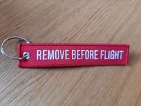 Zawieszka brelok remove before flight