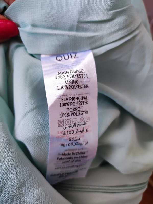 Ouiz r 38 miętowy kombinezon z paskiem Nowy