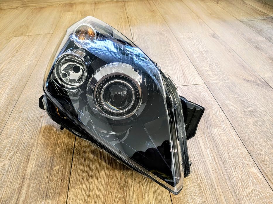 Reflektor lampa przód prawa opel astra h 3 III bixenon skrętny eu