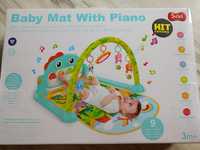 Mata niemowlęca z pianinem