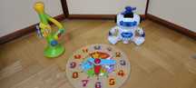 Zabawki Zegar drewniany Robot święcący laser trąbka little tikes