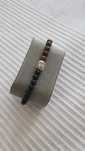 Pulseira em olho de tigre com buda