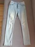 Spodnie jeansy z przetarciami 164cm