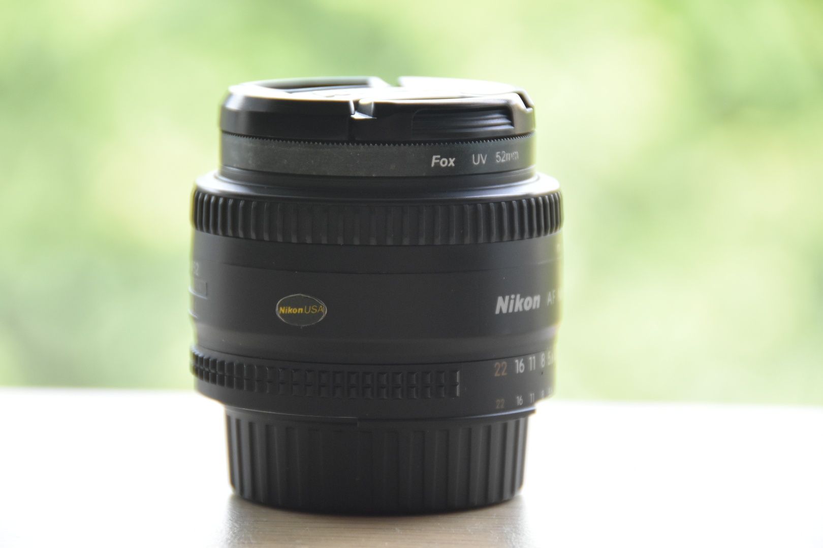 Nikkor 50 1.8 D AF + filtr UV + 2x dekielki + futerał Nikon obiektyw