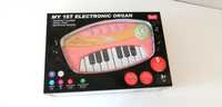 jasnoróżowe grające elektroniczne pianino pianinko smiki smyk keyboard