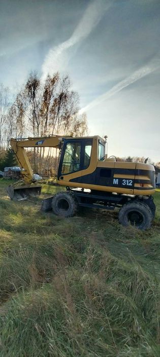 Koparko kołowa Cat 312 M umowa kupna-sprzedaży