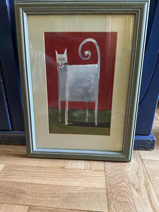 Obraz za szkłem w drewninej ramce.