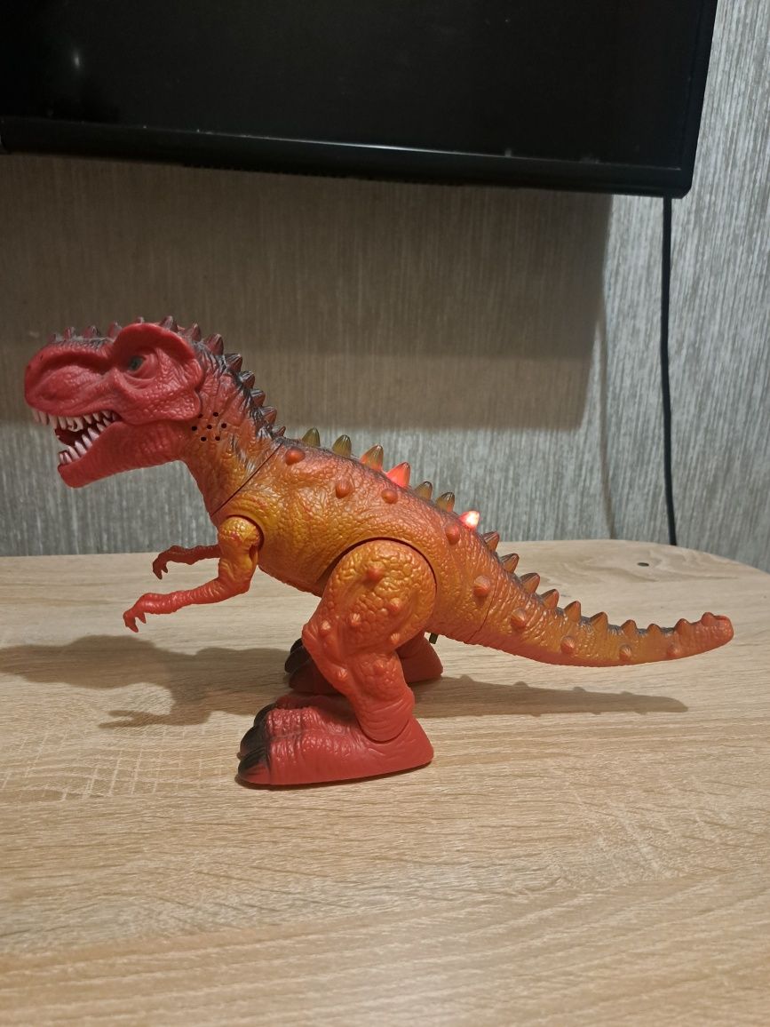 Dinozaur t-rex Tyranozaur Rex chodzi ryczy świeci