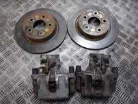 TARCZE HAMULCOWE TYŁ + KLOCKI + ZACISKI FORD FOCUS MK2
