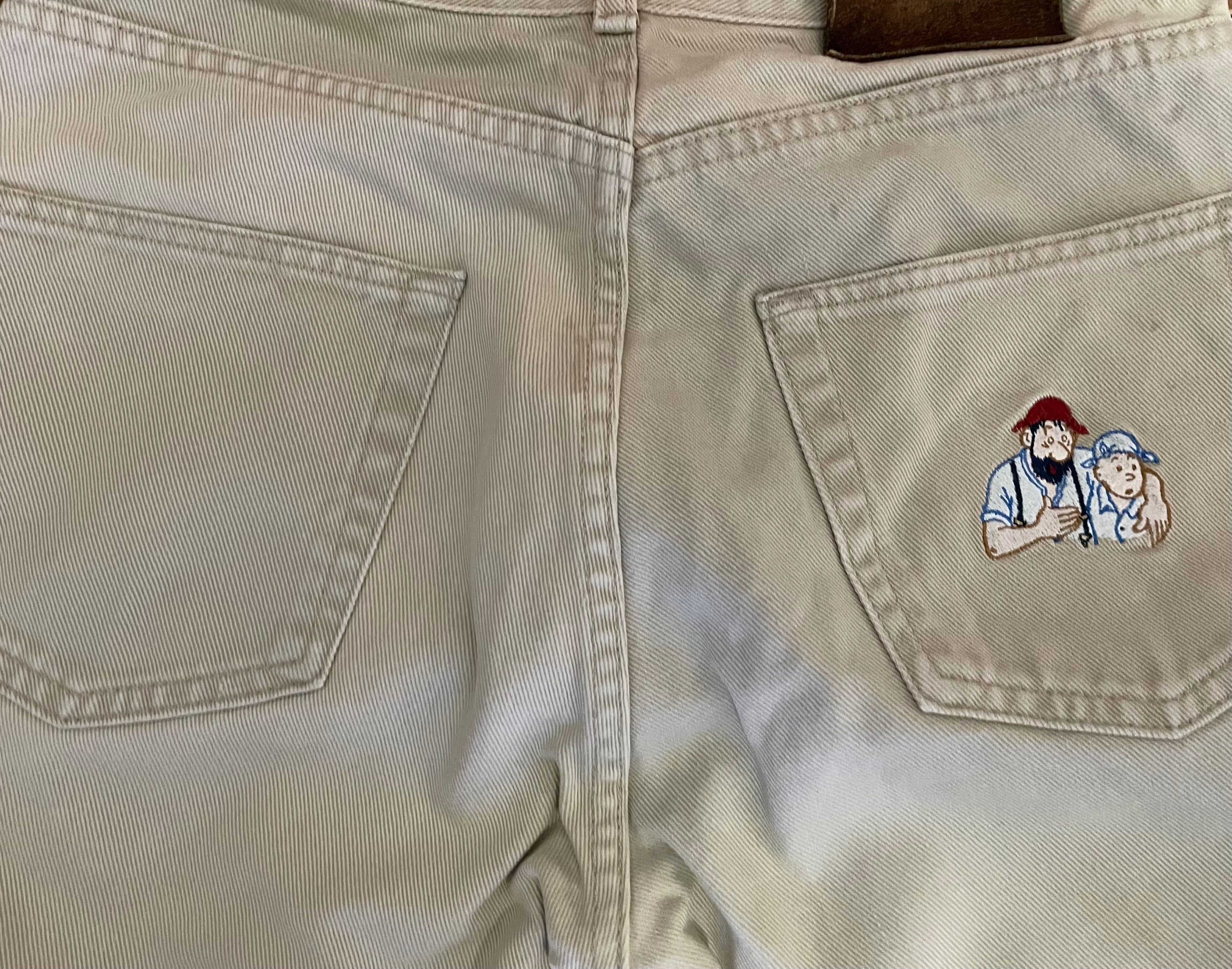 Calças jeans roupa de homem Armani Jeans e Tintim e Milou Aventura