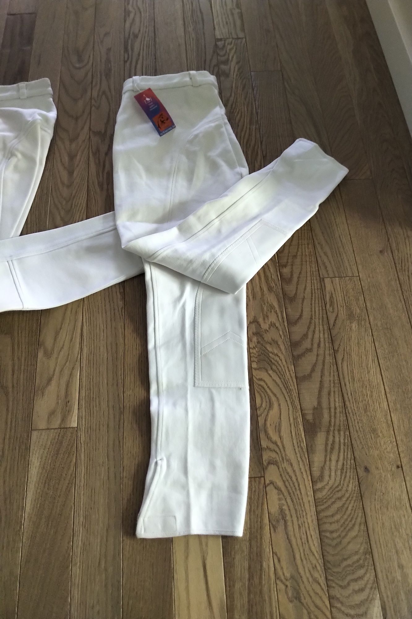 Bryczesy konkursowe białe unisex 46 (s/m) pełen lej nowe