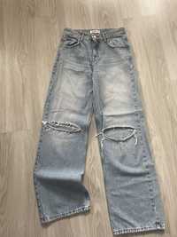 szerokie jeans z dziurami